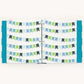 A three-ring binder notebook or planner shown open, featuring a pattern of horizontal bunting banner garlands in shades of green, blue, and gray on a white background, with teal polka-dot side covers.